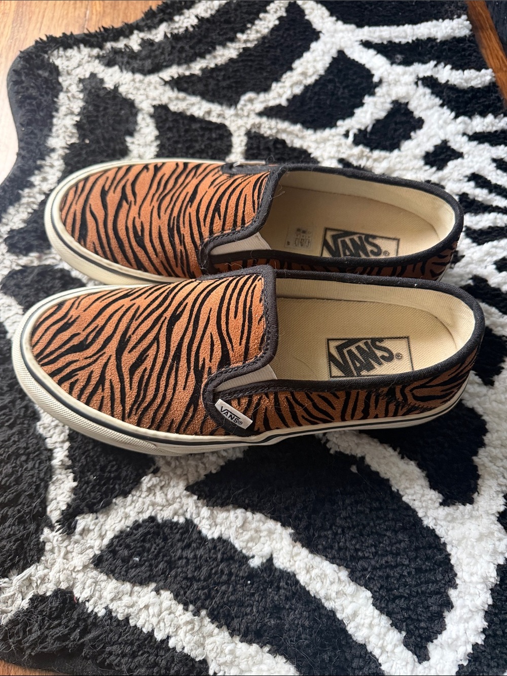 Vans womens Slip-On Sneakers in Orange and Black Tiger Stripe
